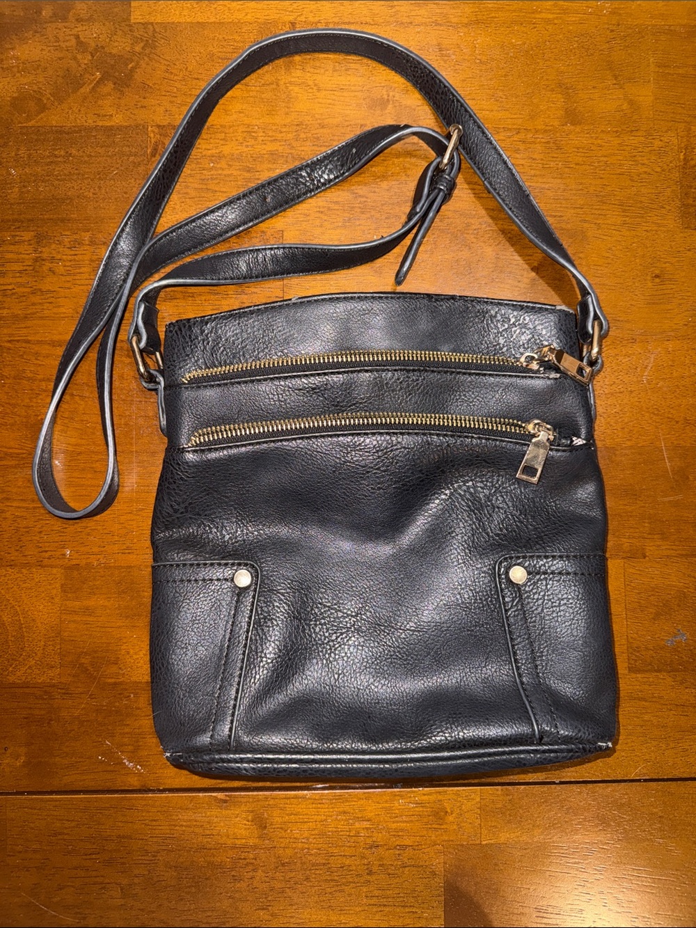 Classic Black Leather Crossbody Bag with Gold Zippers